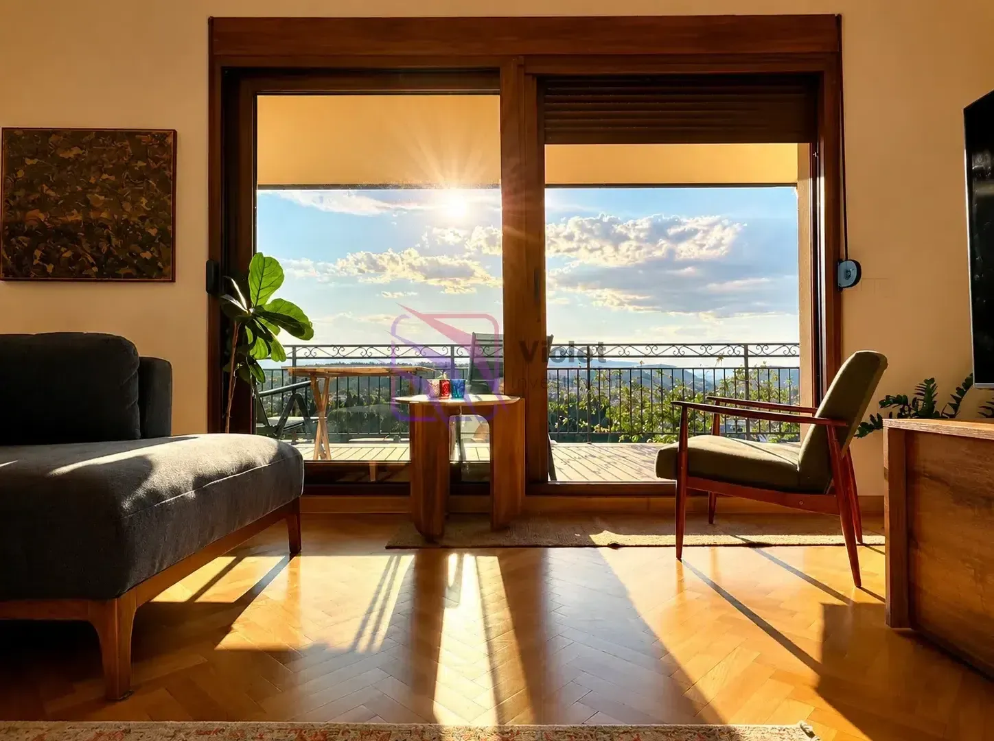 Living room with furniture and large glass doors leading to the terrace.