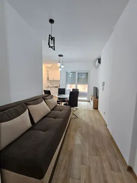 Living room with sofa, dining area and view of the kitchen. - image 6