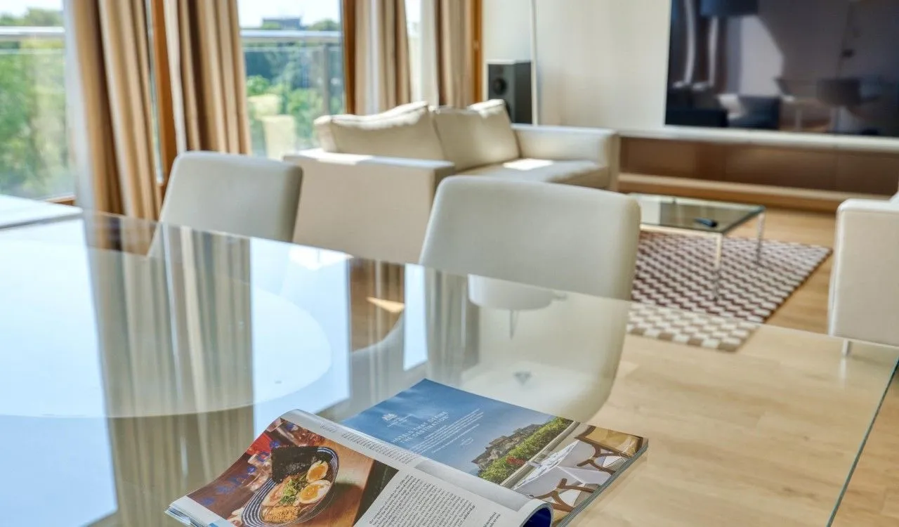 Living room with dining area and modern furniture.