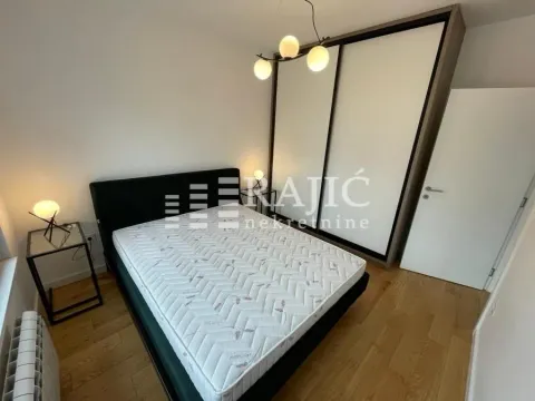 Furnished bedroom with a double bed and a fitted wardrobe. - image 5