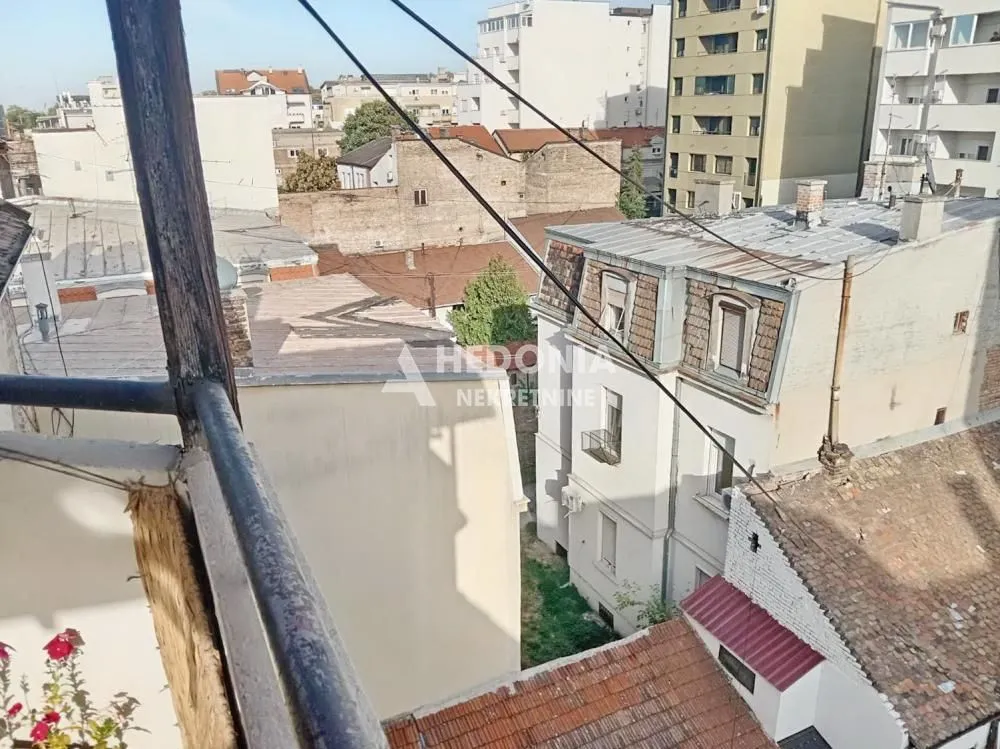 View from the terrace overlooking roofs and surrounding buildings.