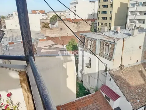 View from the terrace overlooking roofs and surrounding buildings. - image 3