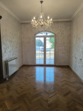 Empty room with parquet flooring, a chandelier, and glass balcony doors. - image 7