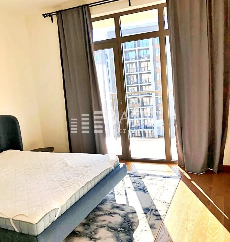 Bedroom with a double bed and terrace access.