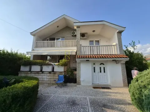 View of a two-story house with a landscaped yard. - image 2