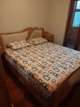 A bedroom with a double bed. - image 9