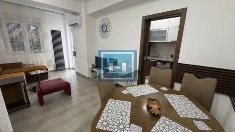 Living room with dining area and view of the kitchen. - image 5