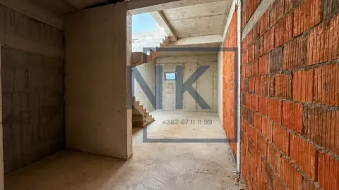 Unfinished interior under construction with stairs and concrete walls. - image 7