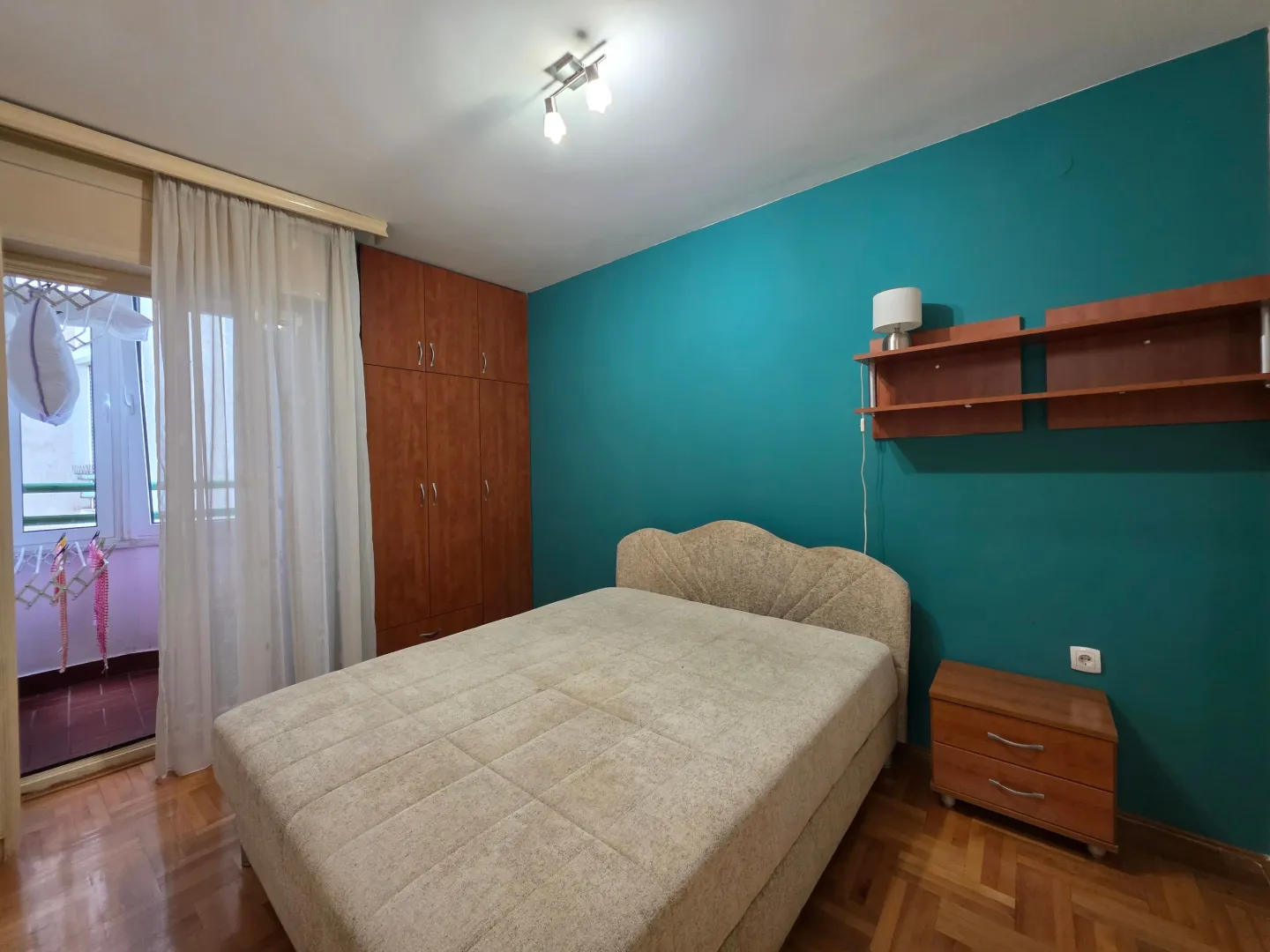 Furnished bedroom with a double bed, wardrobe, and access to the terrace.