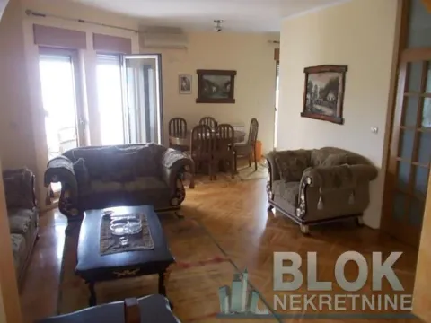 Spacious living room with a sofa set, dining table, and access to the terrace. - image 3