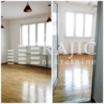 View of an empty room with a wooden floor in an apartment. - image 4