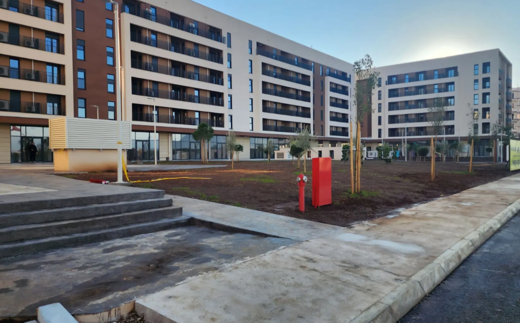 View of the courtyard and facade of new residential buildings.