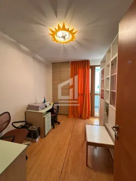 Small room with a desk, wardrobe, and access to the terrace. - image 7