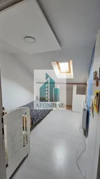 Children's bedroom with a bed and a skylight in the attic. - image 11