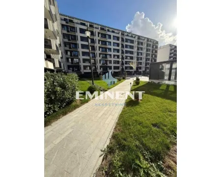 View of the exterior of the residential building with a landscaped courtyard and pathway. - image 12