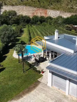 Aerial view of a house with a swimming pool and a spacious yard. - image 3