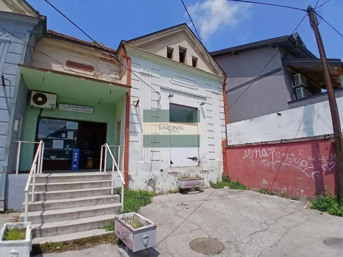 View of the exterior and entrance to the commercial space with stairs.