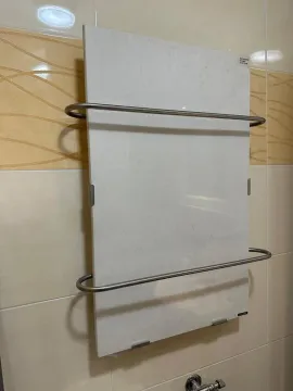 Towel radiator mounted on ceramic tiles in the bathroom. - image 19