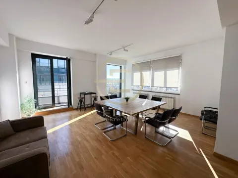 Spacious bright room with a meeting table and a sofa. - image 2