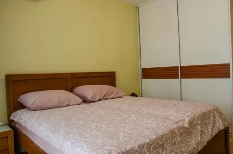 Bright bedroom with a double bed and a sliding-door wardrobe. - image 6