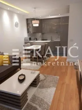 Living room with dining area and kitchen in the background. - image 3