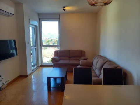 Bright living room with leather sofas and a coffee table. - image 2