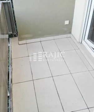Smaller tiled balcony with balcony doors. - image 7
