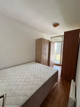 Furnished bedroom with a bed and wardrobes. - image 2