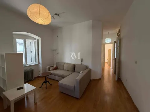 Living room with sofa and window view. - image 2