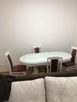 Dining table with chairs in the living room. - image 5