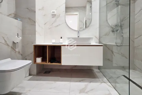 Modern equipped bathroom with a washbasin, mirror, and walk-in shower. - image 15