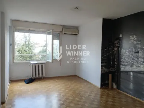 Empty room with parquet flooring and wallpaper on the wall. - image 8