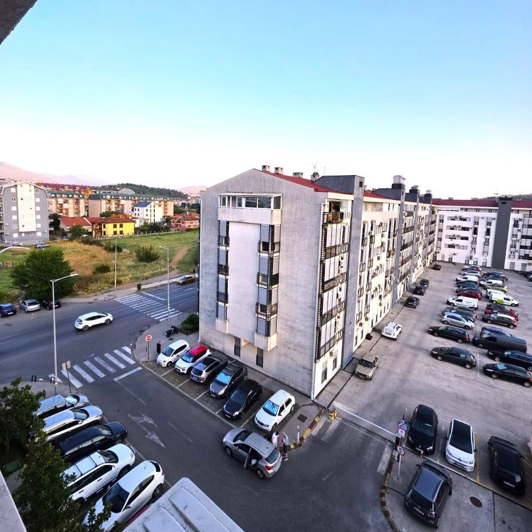 View from the terrace overlooking the building and surrounding parking.