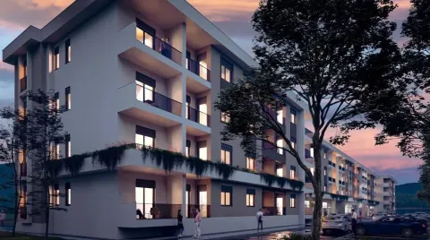 Pogled na spoljašnjost moderne stambene zgrade u sumrak. - image 2