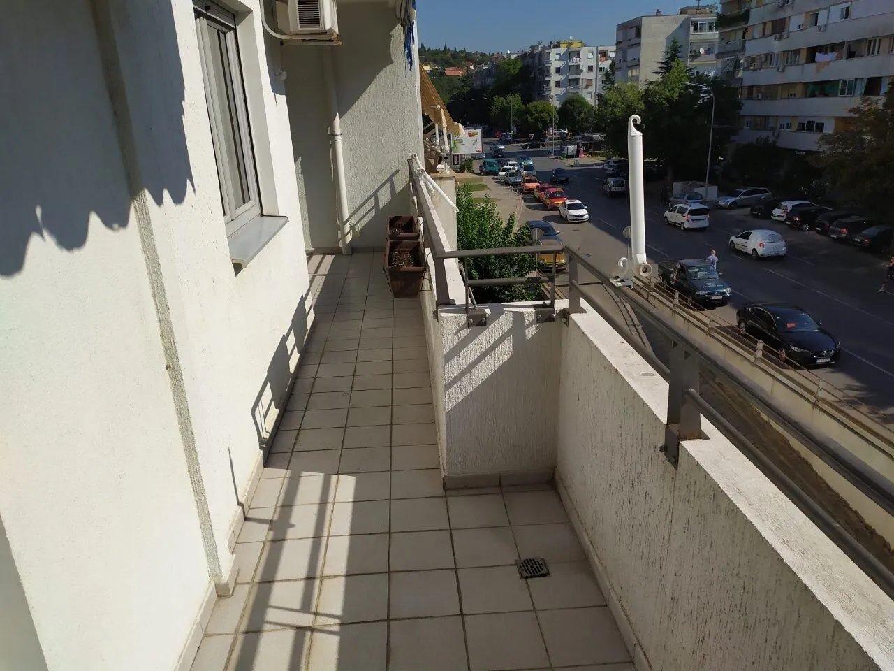 A long balcony overlooking the street.