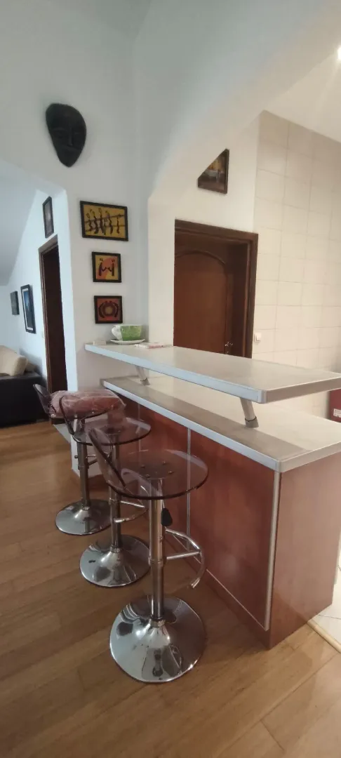 Bar counter with bar stools in the kitchen.