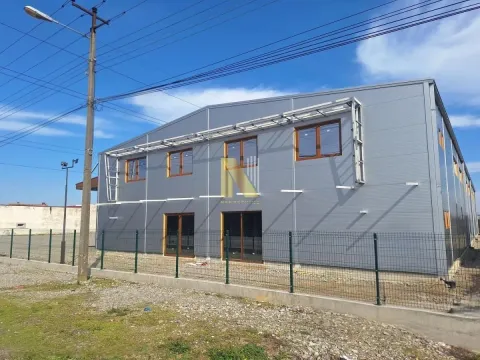 Exterior view of a modern commercial building with a fence. - image 9