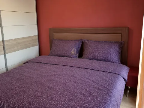 Furnished bedroom with a double bed and a fitted wardrobe. - image 5