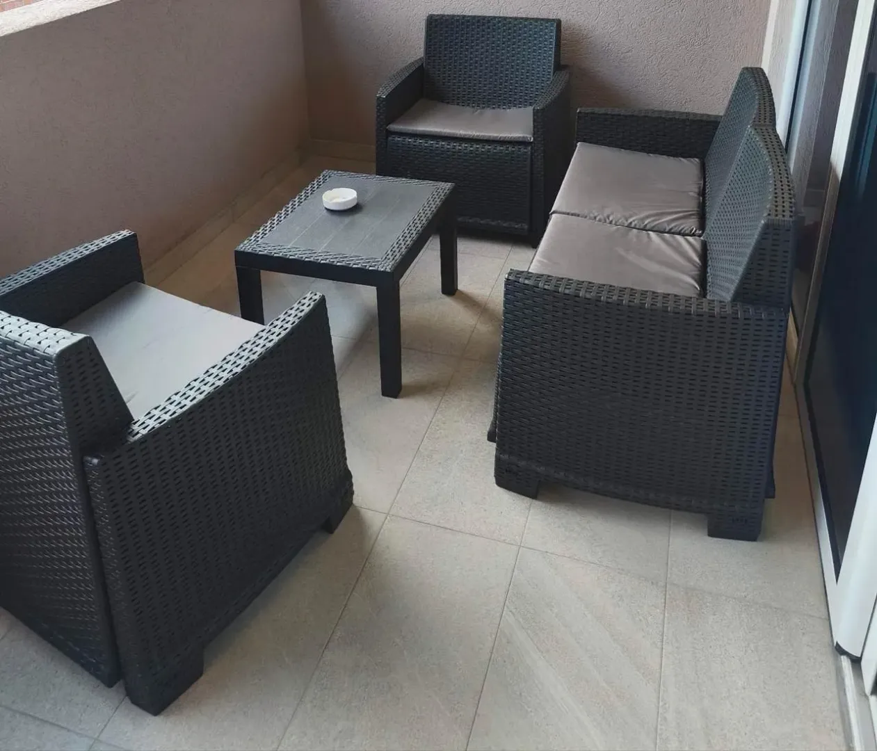Furnished terrace with seating furniture.