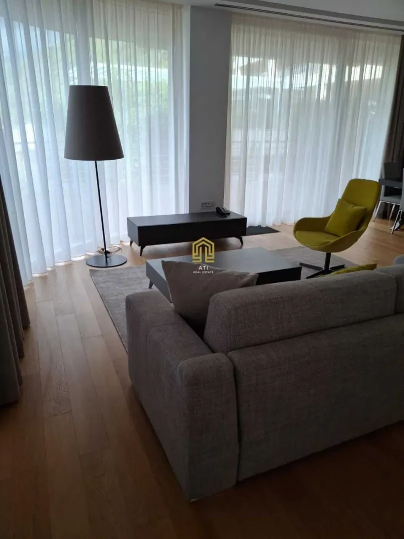 Living room furnished with modern furniture and a sofa set.