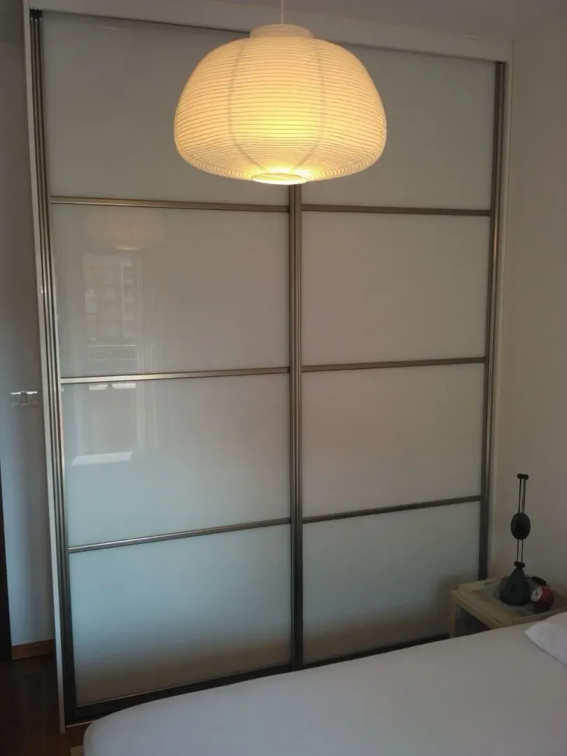 Bedroom with a large built-in wardrobe.