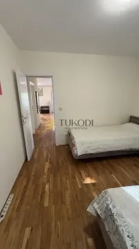 Bedroom with two beds and a view of the hallway. - image 15