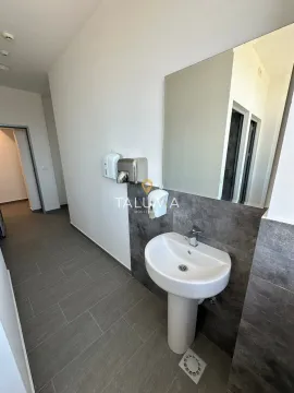 View of the washbasin with a mirror in a modern bathroom. - image 8