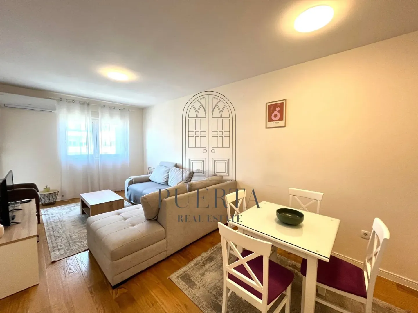 Living room with dining area and sofa.