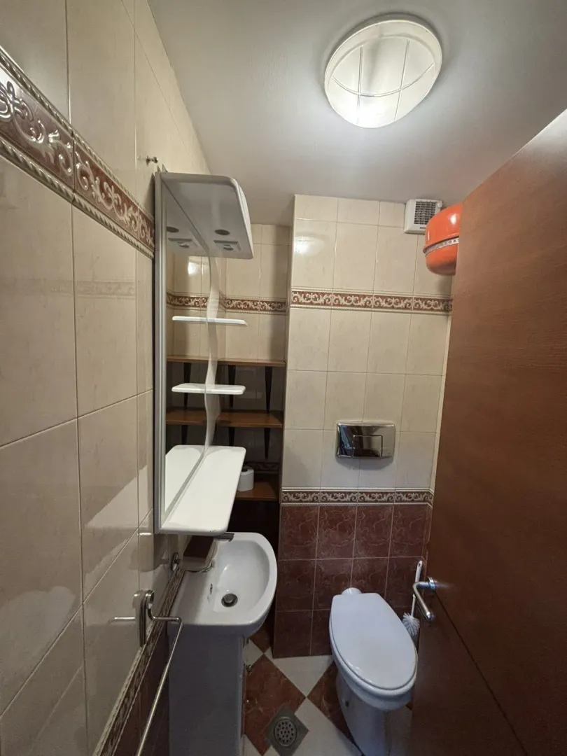 Bathroom with sink and toilet.