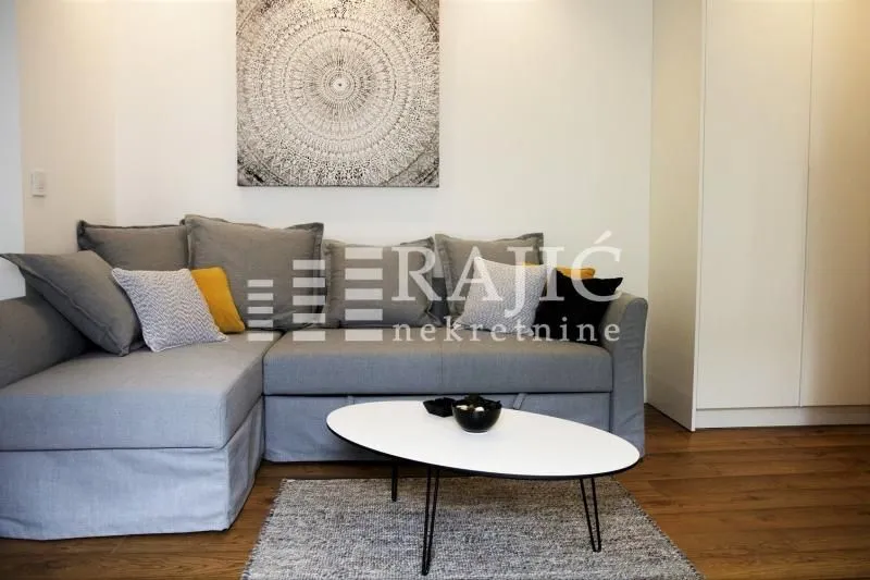 Comfortable living room with a sectional sofa and a coffee table.