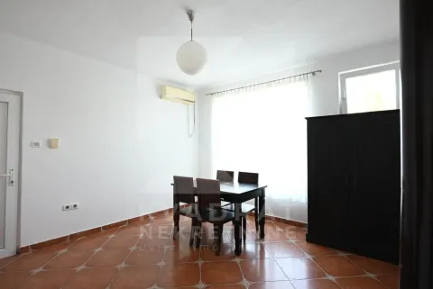 Bright room with a dining table and chairs near the window. - image 20