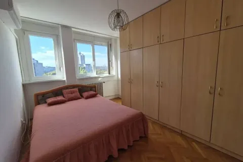 Bedroom with a double bed and a large built-in wardrobe. - image 7