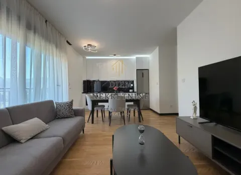 Modern living room with a sofa and dining area in the background. - image 8