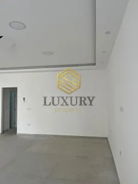 Empty bright room with white walls and tiled floors. - image 3